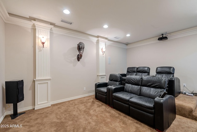 cinema featuring visible vents, decorative columns, ornamental molding, and carpet floors