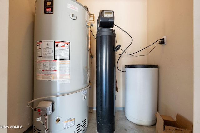 utility room featuring water heater
