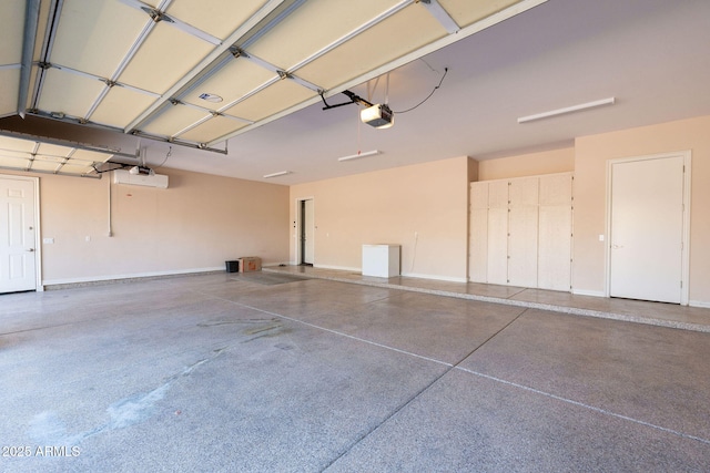 garage with baseboards and a garage door opener