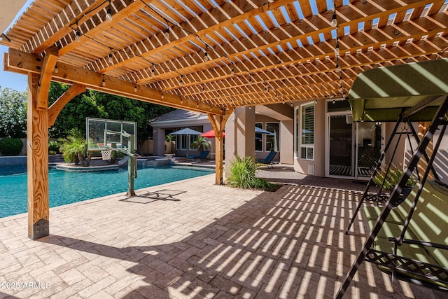 view of pool featuring a pergola, a patio, and a pool with connected hot tub