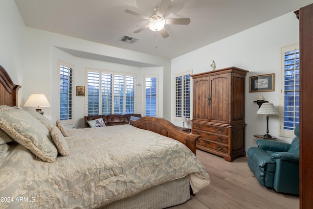 bedroom featuring ceiling fan and light hardwood / wood-style floors