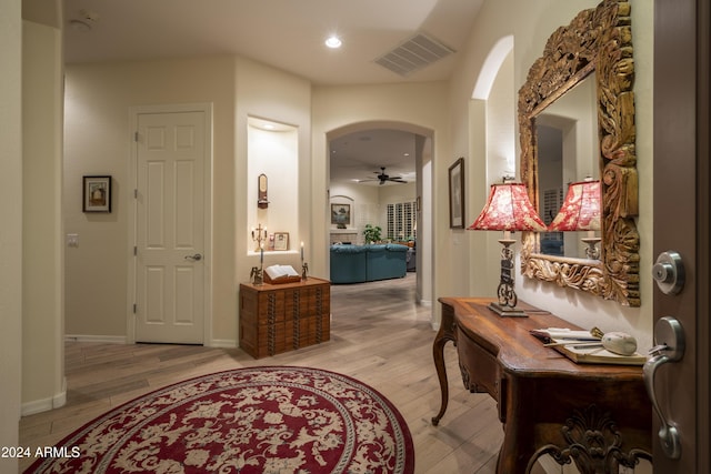 corridor featuring light hardwood / wood-style floors