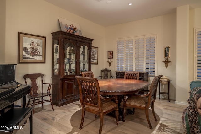 dining area with light hardwood / wood-style floors