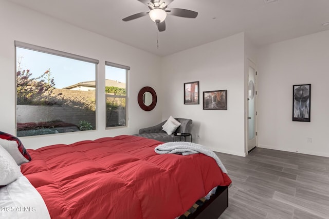 bedroom featuring hardwood / wood-style floors and ceiling fan