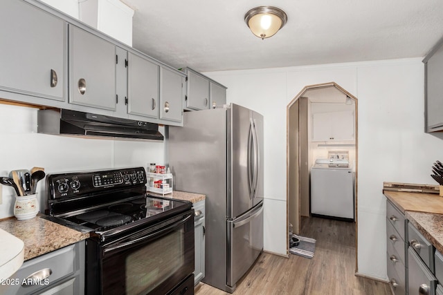 13638 S Sage Brush Dr, Mayer, AZ 86333 - kitchen featuring black / electric stove, washer / clothes dryer, gray cabinetry, and under cabinet range hood