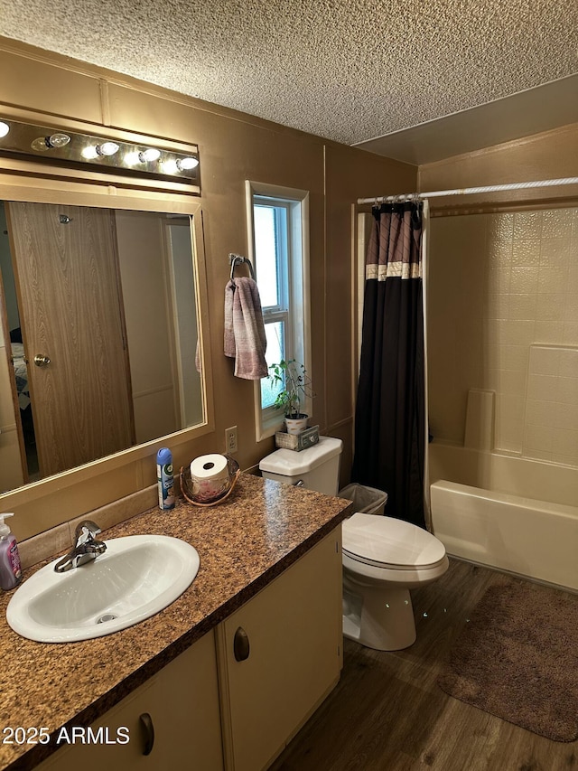 13638 S Sage Brush Dr, Mayer, AZ 86333 - full bathroom featuring wood finished floors, vanity, toilet, shower / tub combo with curtain, and a textured ceiling