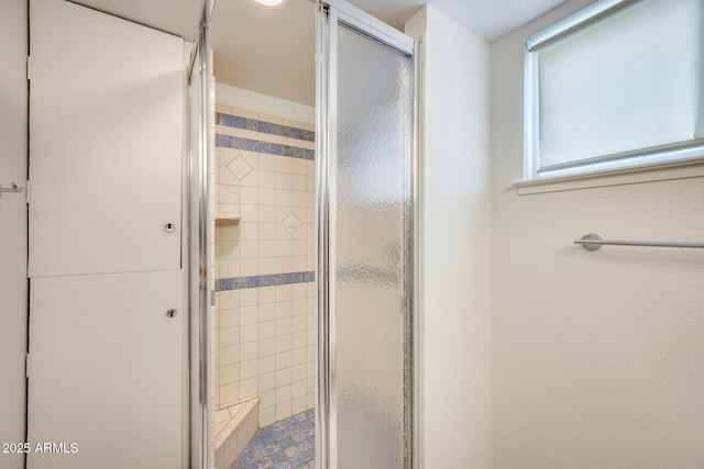 bathroom featuring a shower stall