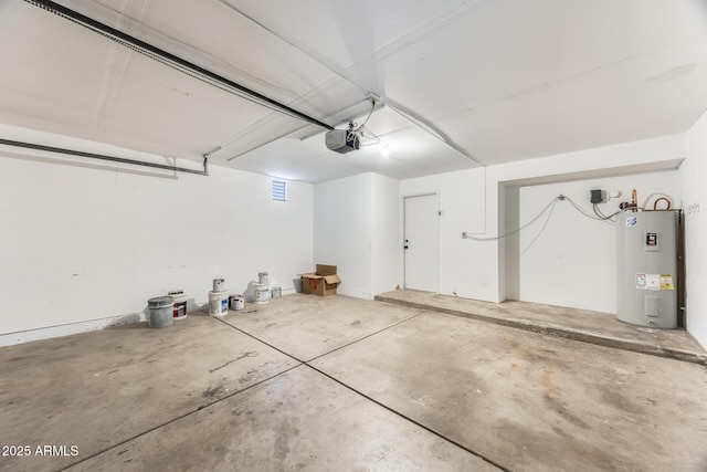 garage with a garage door opener and water heater