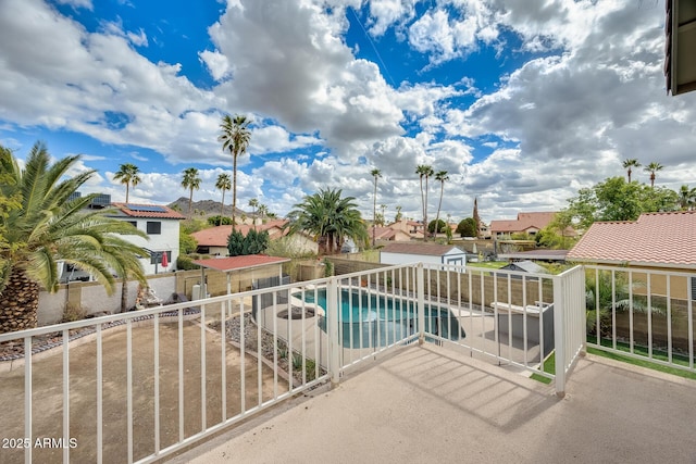 balcony with a residential view and a patio