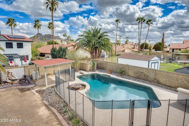 view of pool featuring a fenced in pool, a fenced backyard, and a residential view