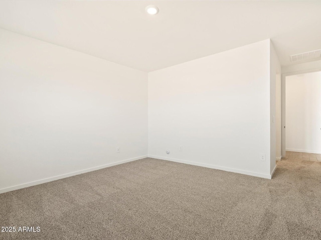 carpeted empty room with recessed lighting, visible vents, and baseboards