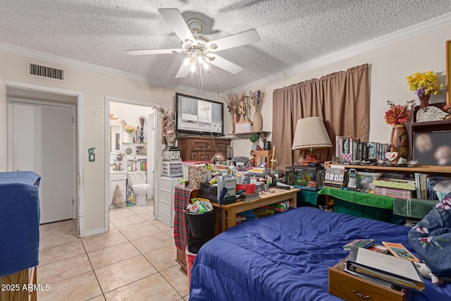 bedroom with tile patterned floors, visible vents, and ornamental molding