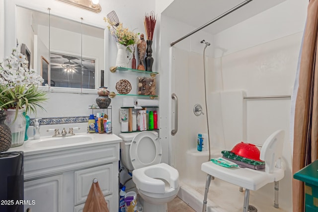 full bath featuring vanity, toilet, and a shower stall