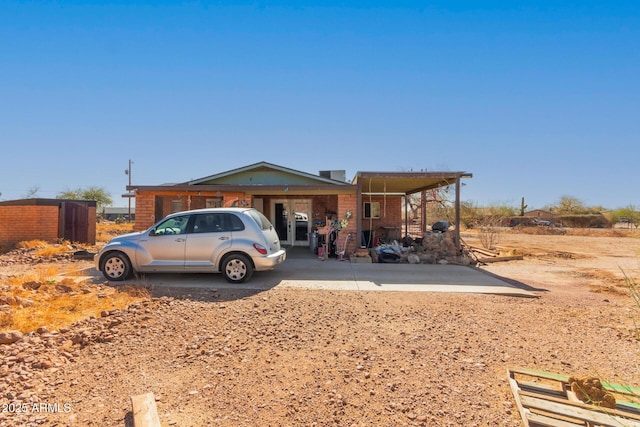 view of front of home featuring brick siding and french doors