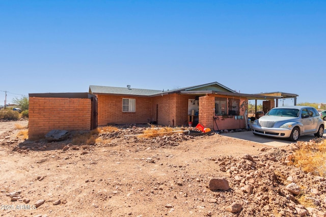 view of front of house with brick siding