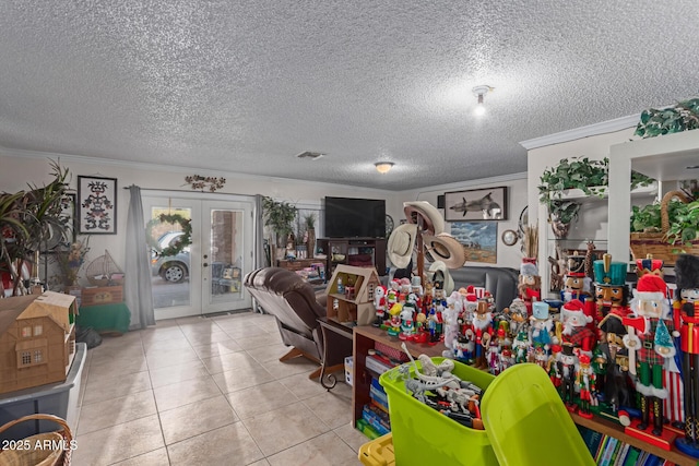 interior space featuring visible vents, crown molding, french doors, tile patterned floors, and a textured ceiling