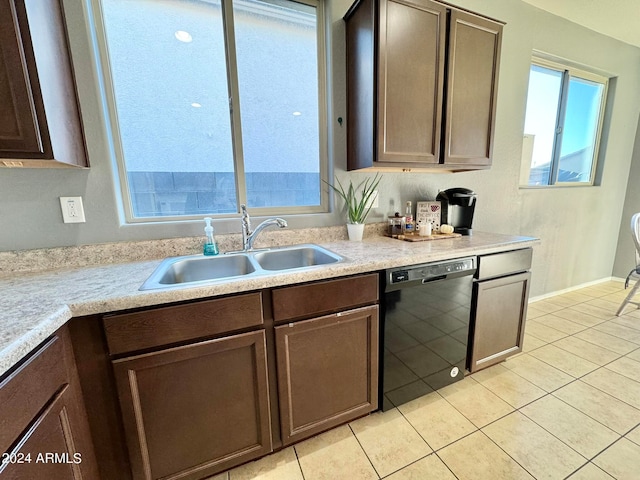 kitchen with dark brown cabinets, light tile patterned floors, dishwasher, and sink