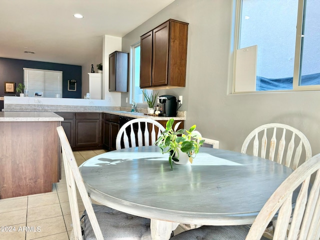 dining area featuring light tile patterned floors