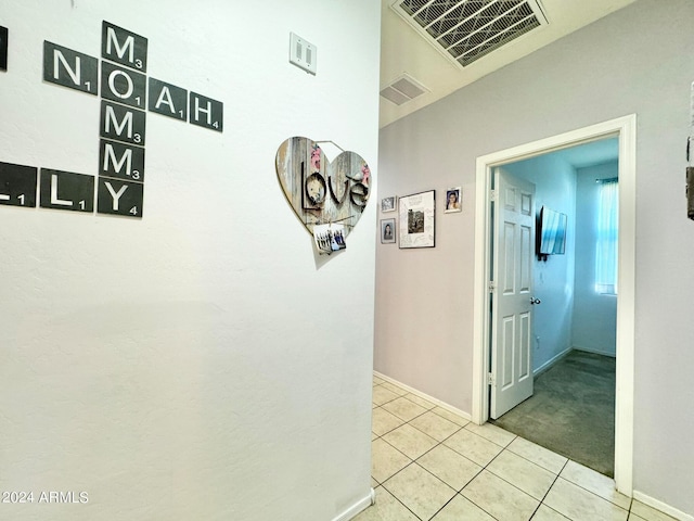 hallway with light tile patterned flooring