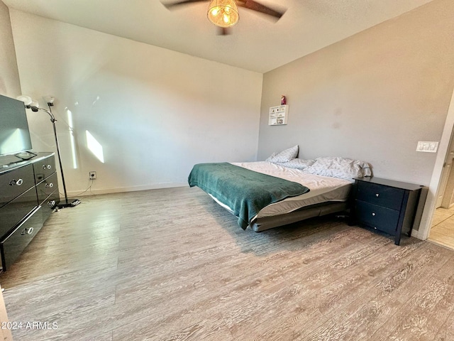 bedroom featuring ceiling fan and light hardwood / wood-style flooring