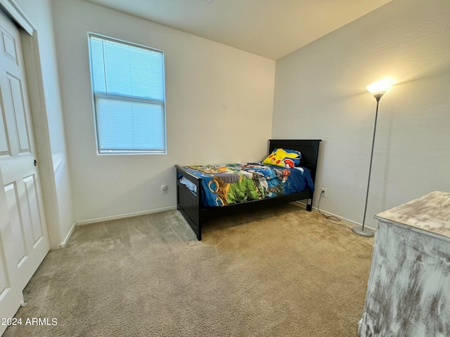 bedroom with light colored carpet