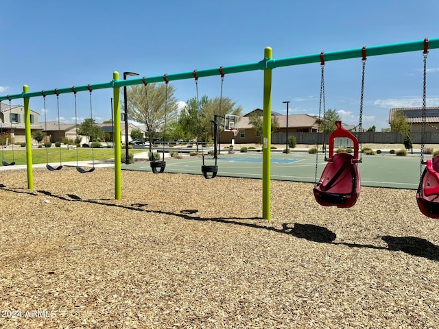 view of jungle gym featuring basketball court