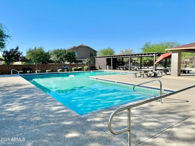 view of swimming pool featuring a patio area