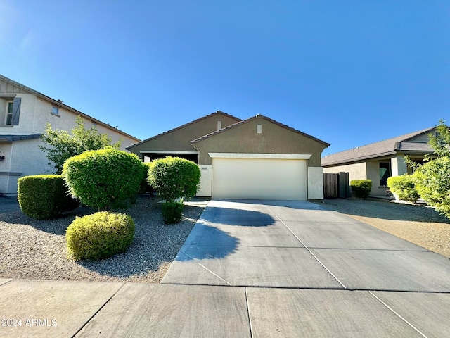 single story home featuring a garage