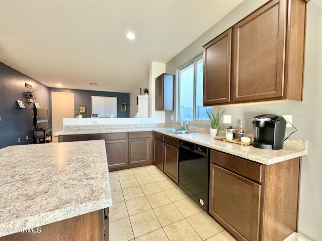 kitchen with dishwasher, kitchen peninsula, light tile patterned floors, and sink