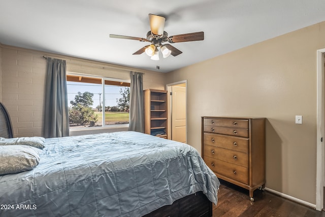 bedroom featuring dark hardwood / wood-style flooring and ceiling fan