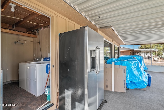 interior space with washer and dryer and dark carpet