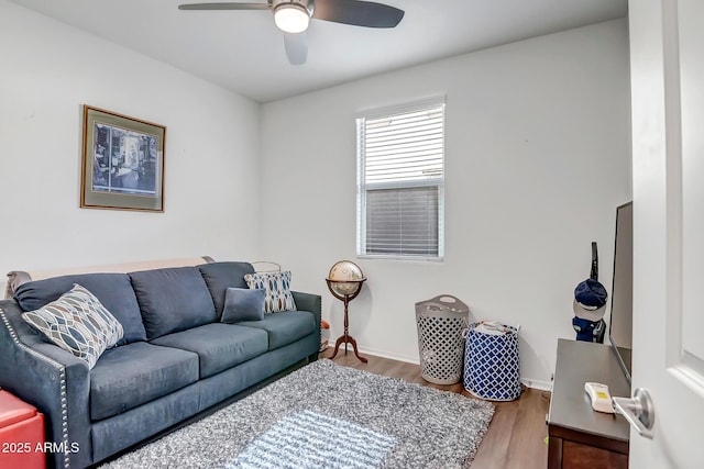 living room featuring hardwood / wood-style flooring and ceiling fan