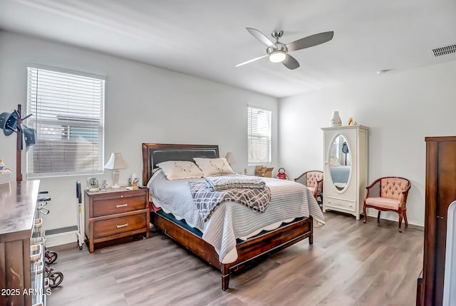 bedroom with hardwood / wood-style flooring and ceiling fan