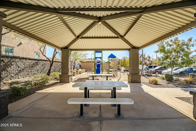 view of patio / terrace featuring a gazebo and a playground