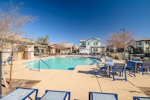 view of swimming pool with a patio