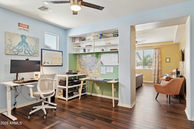 office space featuring a ceiling fan, wood finished floors, and baseboards