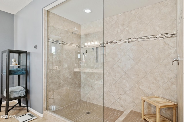 bathroom featuring a tile shower