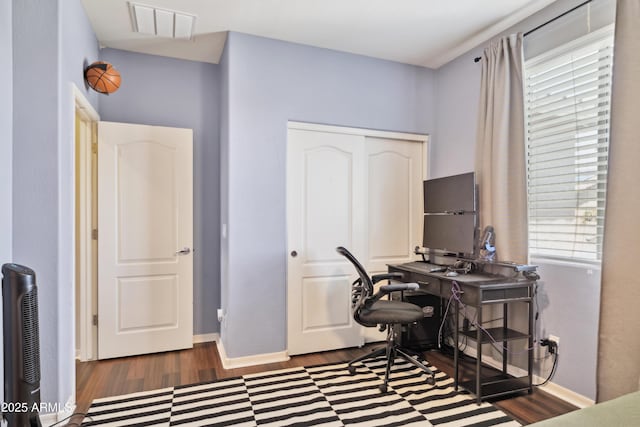 home office featuring wood finished floors and baseboards