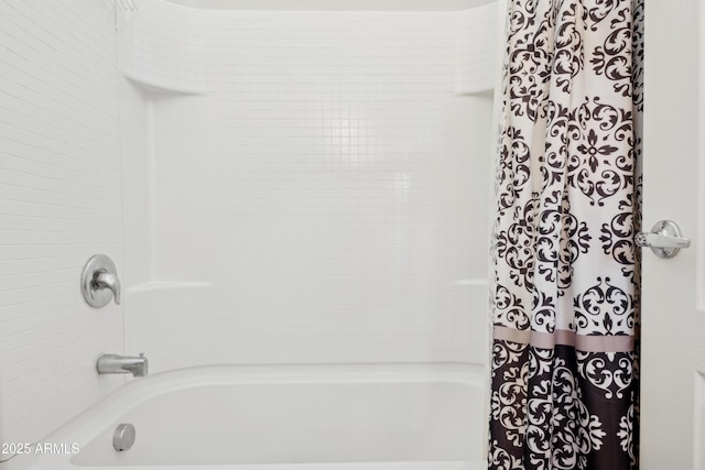full bathroom featuring shower / bath combo with shower curtain
