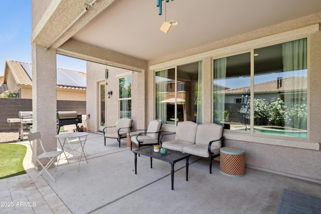 view of patio / terrace featuring fence and an outdoor living space
