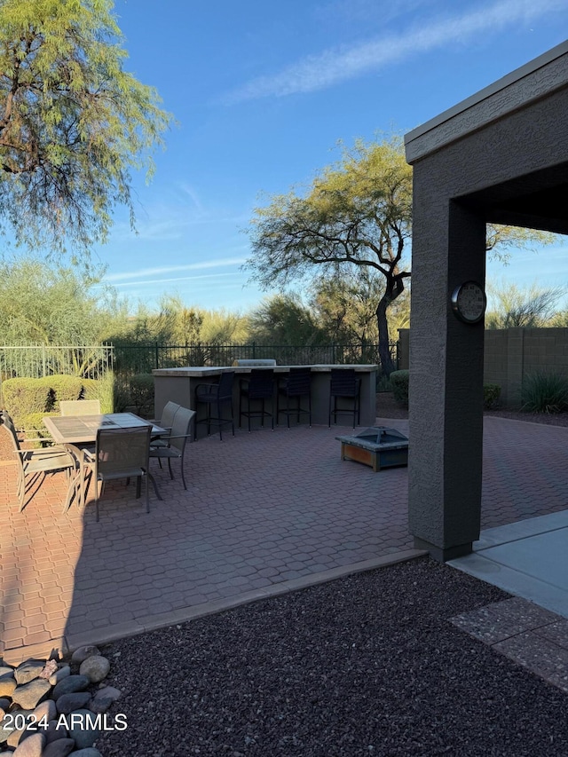 view of patio featuring an outdoor bar