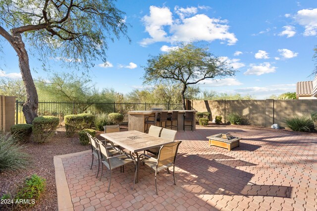 view of patio featuring exterior bar