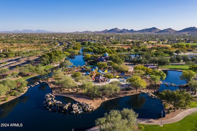 bird's eye view with a water and mountain view