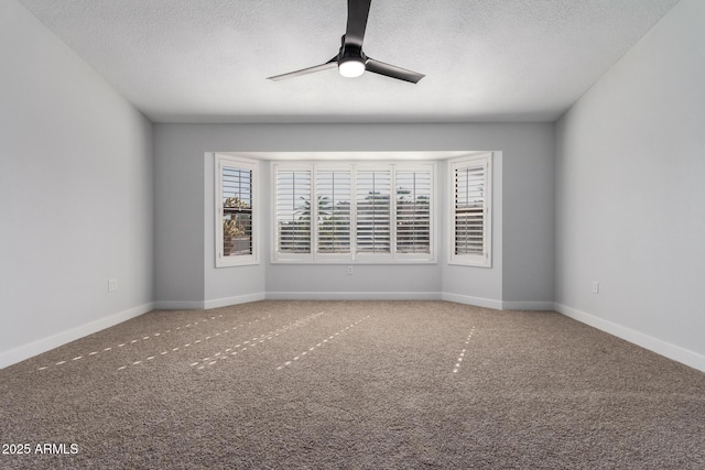 empty room with a textured ceiling, ceiling fan, and carpet flooring