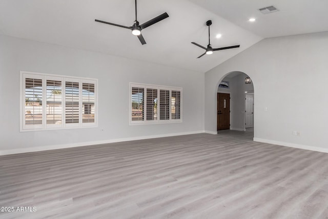 unfurnished living room featuring ceiling fan, light hardwood / wood-style flooring, and high vaulted ceiling