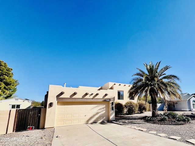 adobe home featuring a garage