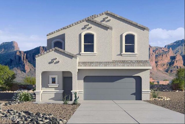 5058 E Umber Rd, San Tan Valley, AZ 85143 - view of front of house featuring a garage, concrete driveway, a mountain view, and stucco siding
