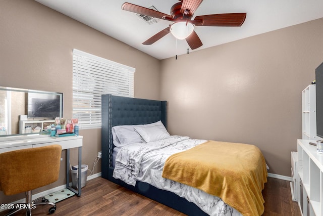 bedroom featuring ceiling fan and dark hardwood / wood-style floors