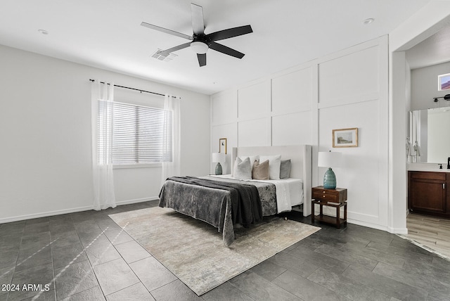 bedroom with ceiling fan and ensuite bathroom