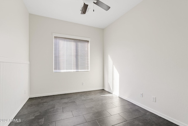 empty room featuring vaulted ceiling and ceiling fan